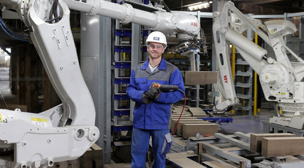 Magnesita - Mann vor Maschine